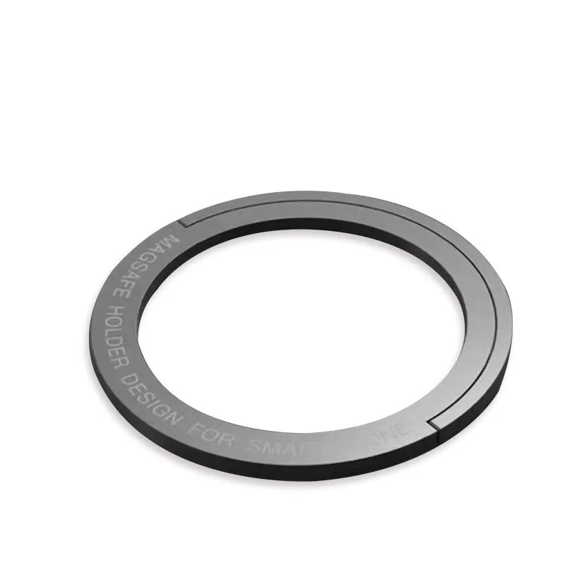 Portable round zinc alloy mobile phone holder in black on a desk for wireless charging