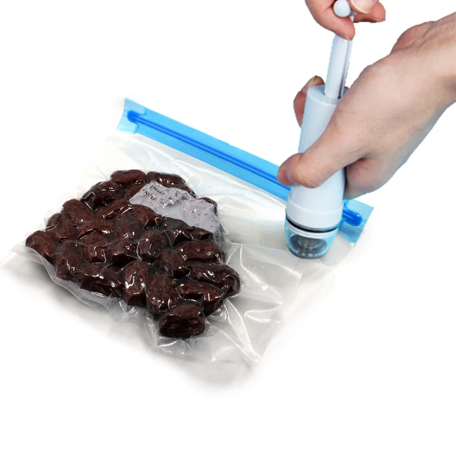 Green manual vacuum compression storage bag with hand pump on a grey background