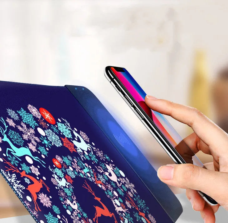 Wireless charging mouse pad with RGB lighting and cartoon design, showing cloth surface and rubber base