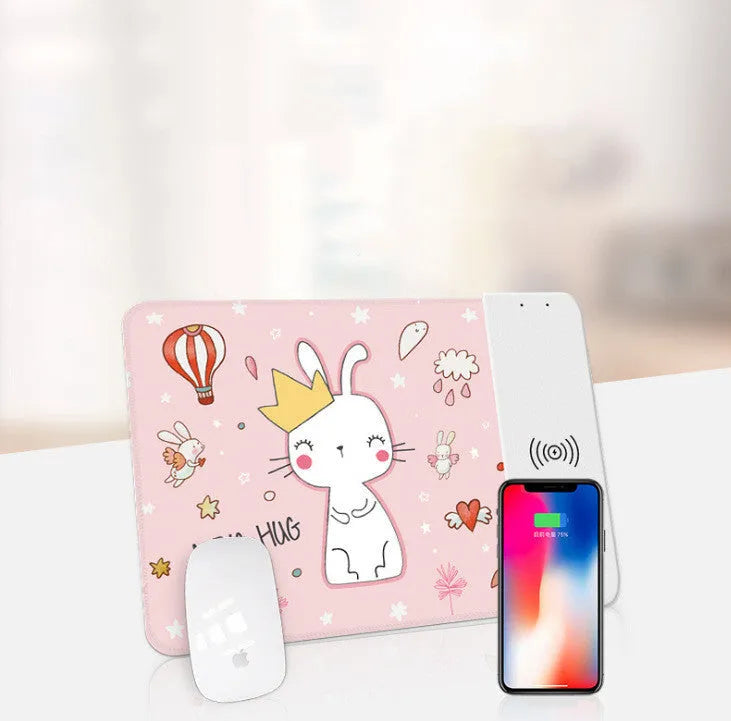 Wireless charging mouse pad with RGB lighting and cartoon design, showing cloth surface and rubber base