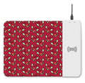Wireless charging mouse pad with RGB lighting and cartoon design, showing cloth surface and rubber base