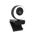 Black USB webcam on a stand with magnetic privacy cover slid over the lens