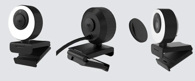 Black USB webcam on a stand with magnetic privacy cover slid over the lens