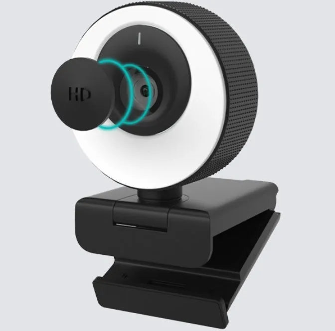 Black USB webcam on a stand with magnetic privacy cover slid over the lens
