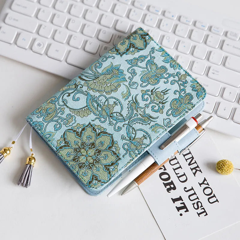 Fabric cover Flying Blue Flower series notebook in A5 and A6 sizes.