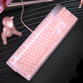 Pink mechanical keyboard and wired mouse gaming set with USB connections on pink background
