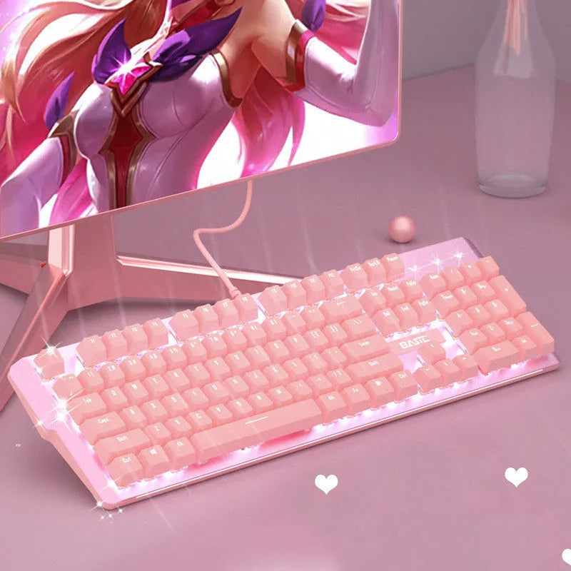 Pink mechanical keyboard and wired mouse gaming set with USB connections on pink background