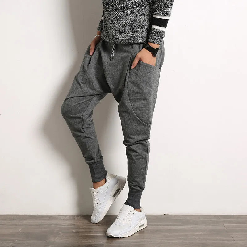 Japanese solid colour men's harem suspender pants in black, loose baggy fit with belt