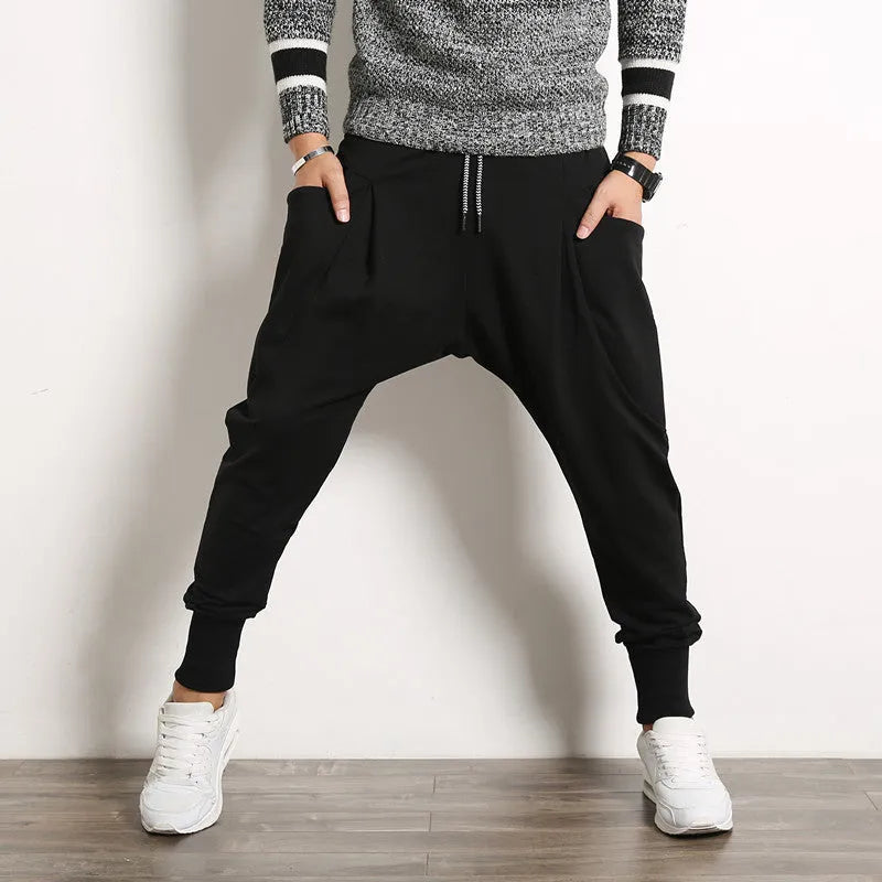 Japanese solid colour men's harem suspender pants in black, loose baggy fit with belt