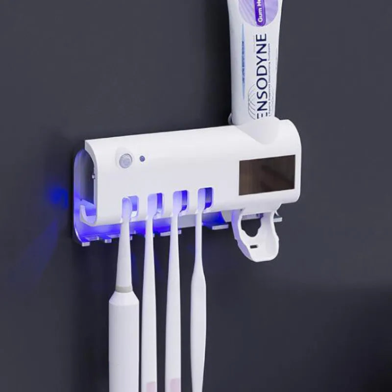 Black wall-mounted UV toothbrush steriliser and automatic toothpaste squeezer unit with solar panel.