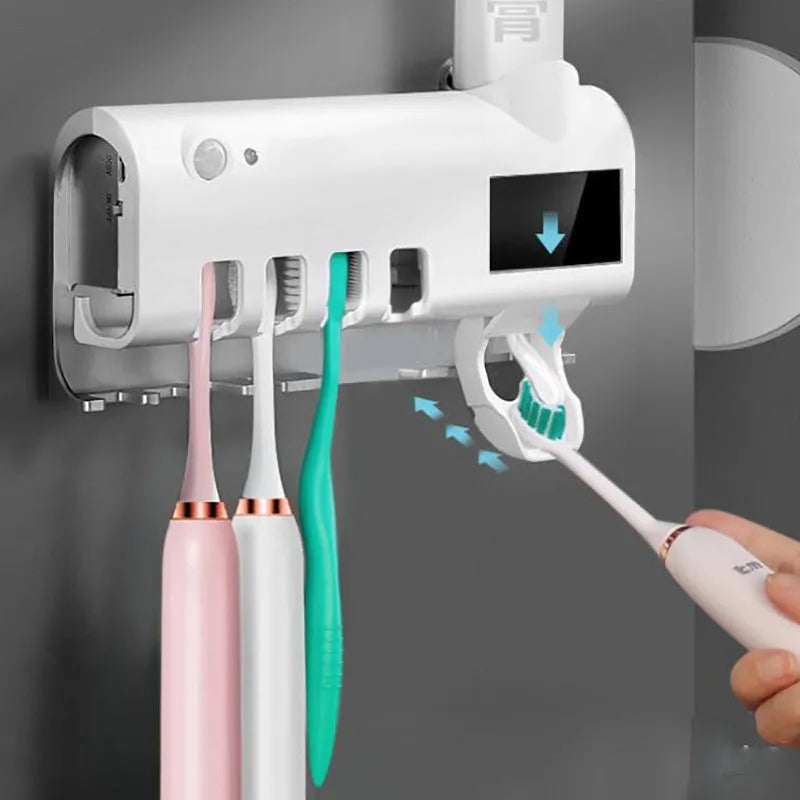 Black wall-mounted UV toothbrush steriliser and automatic toothpaste squeezer unit with solar panel.