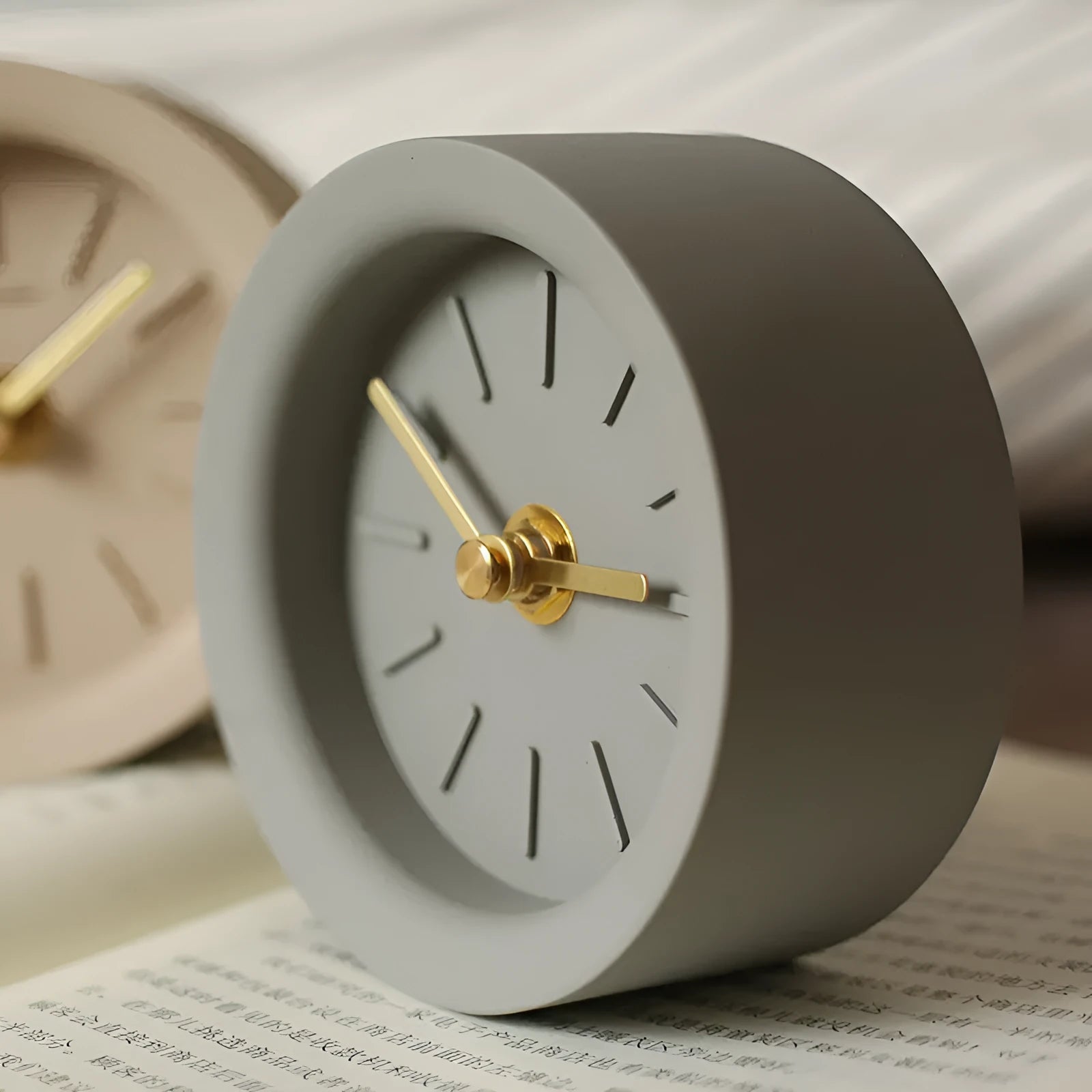 Industrial style cement silent desk clock with sweep movement, 4-inch round dial in rock brown colour on a wooden desk