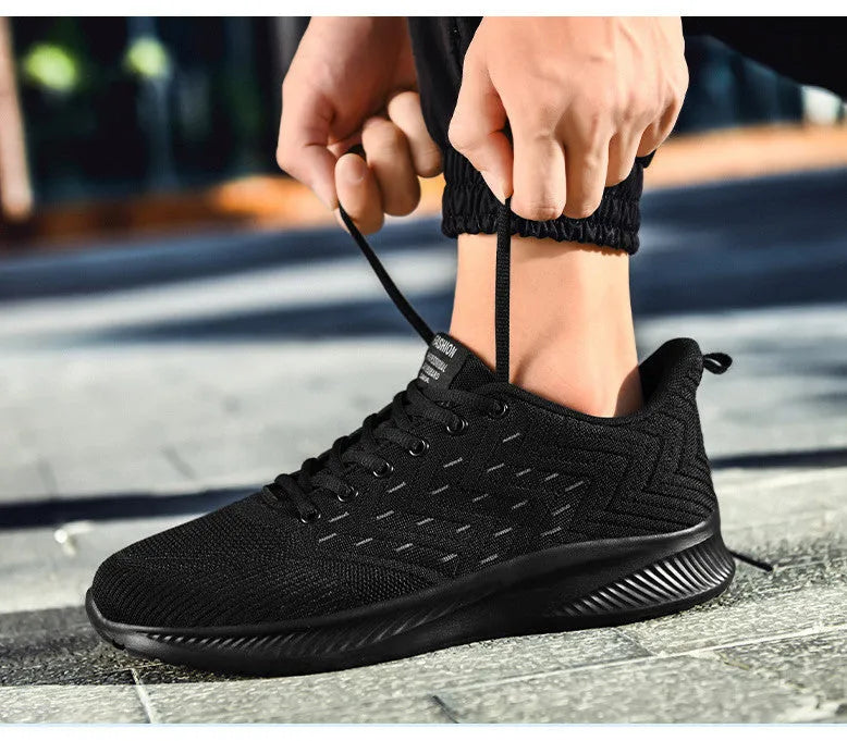 Men's breathable lightweight sports casual running shoes with fabric upper, mesh lining, and MD sole, front tie and cross straps.
