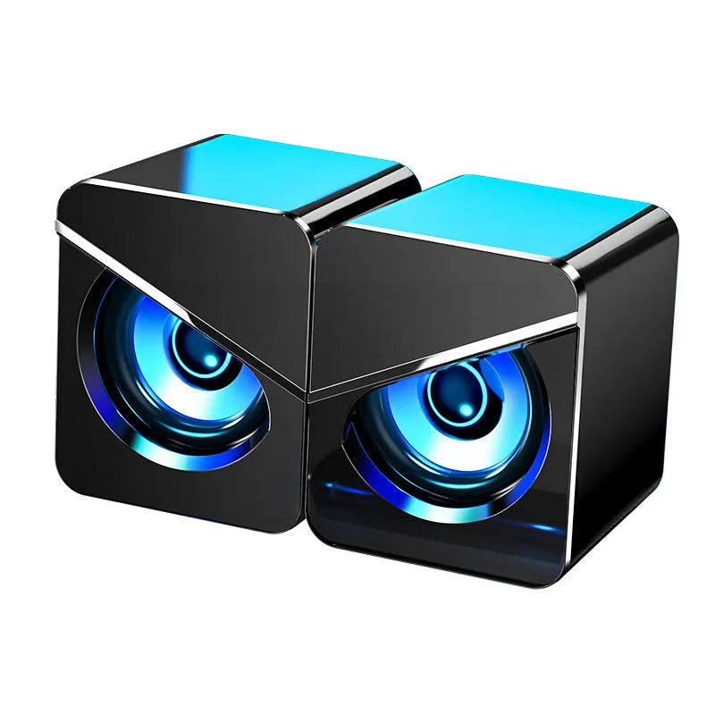 Black and white desktop computer speakers with USB cable and 3.5mm audio jack connection