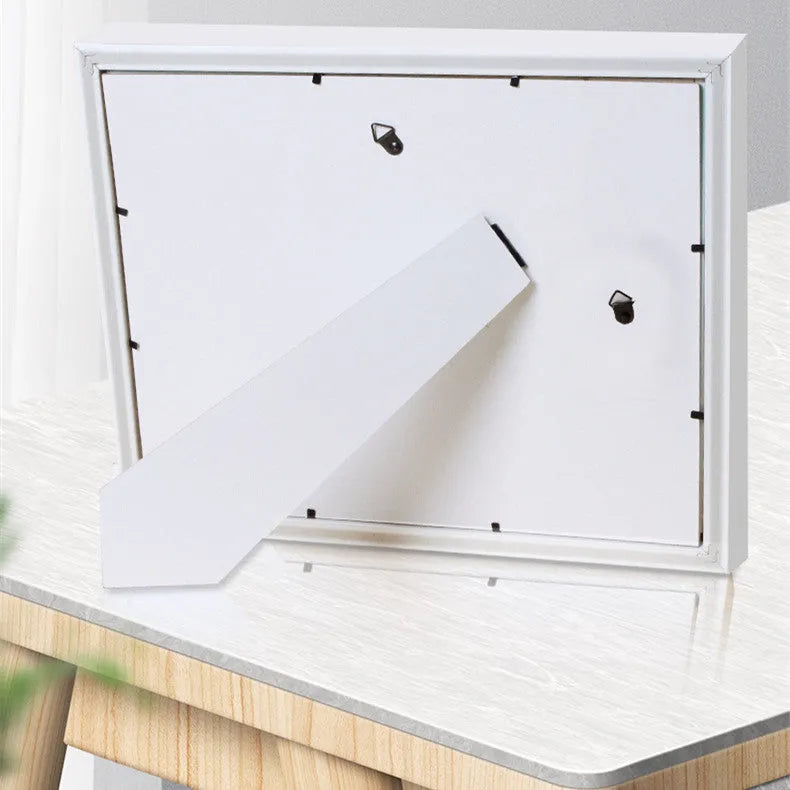 Modern cartoon-style baby hand and foot print anniversary frame in solid wood and MDF construction
