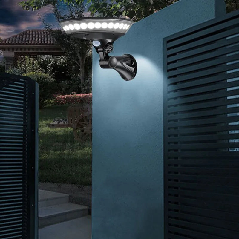White 360-degree solar-powered outdoor security light with a motion sensor and solar panel on top.