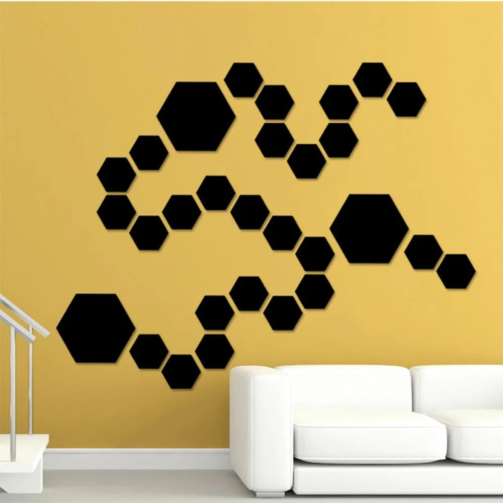 Silver hexagonal acrylic mirror wall sticker with PS build, 100x85x50mm, on a wall surface