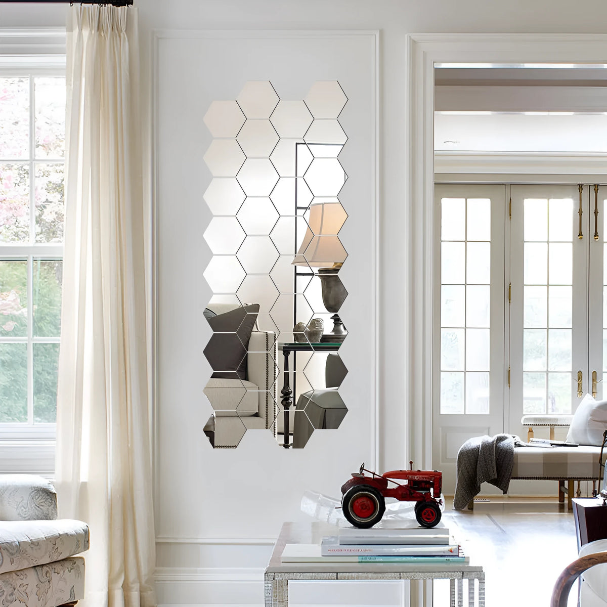 Silver hexagonal acrylic mirror wall sticker with PS build, 100x85x50mm, on a wall surface