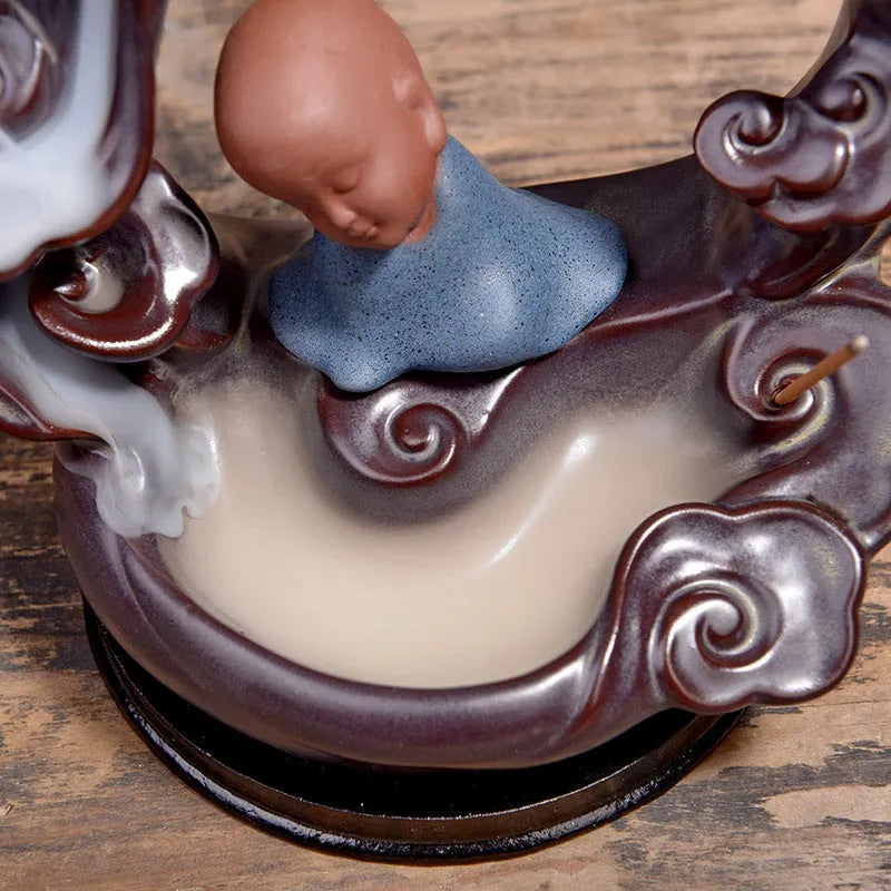 Ceramic backflow incense burner in Zen Lotus Pond Yellow with traditional pottery finish on a wooden table