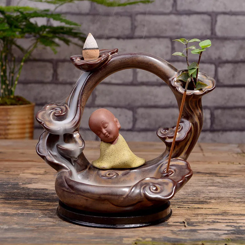 Ceramic backflow incense burner in Zen Lotus Pond Yellow with traditional pottery finish on a wooden table