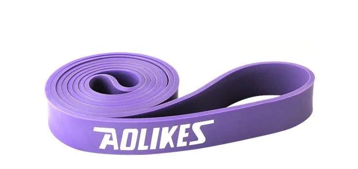 Natural latex rally resistance band in multiple colours: red, black, purple, green, and blue