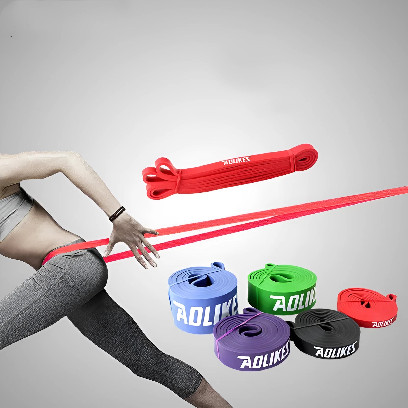 Natural latex rally resistance band in multiple colours: red, black, purple, green, and blue