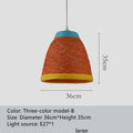 Natural woven rattan hanging lamp with adjustable cord in a light coffee colour, suspended from a ceiling.