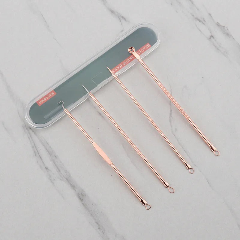 Rose gold acne needle set with four stainless steel tools on a white background