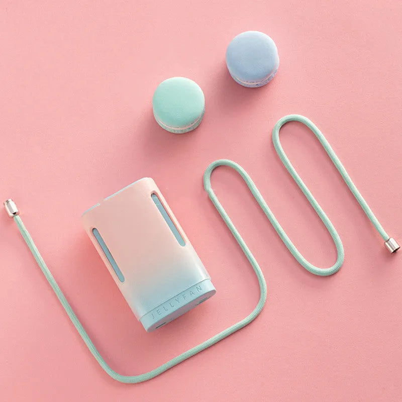 Jelly brand mint peach coloured USB rechargeable hanging neck fan and handheld mini fan.