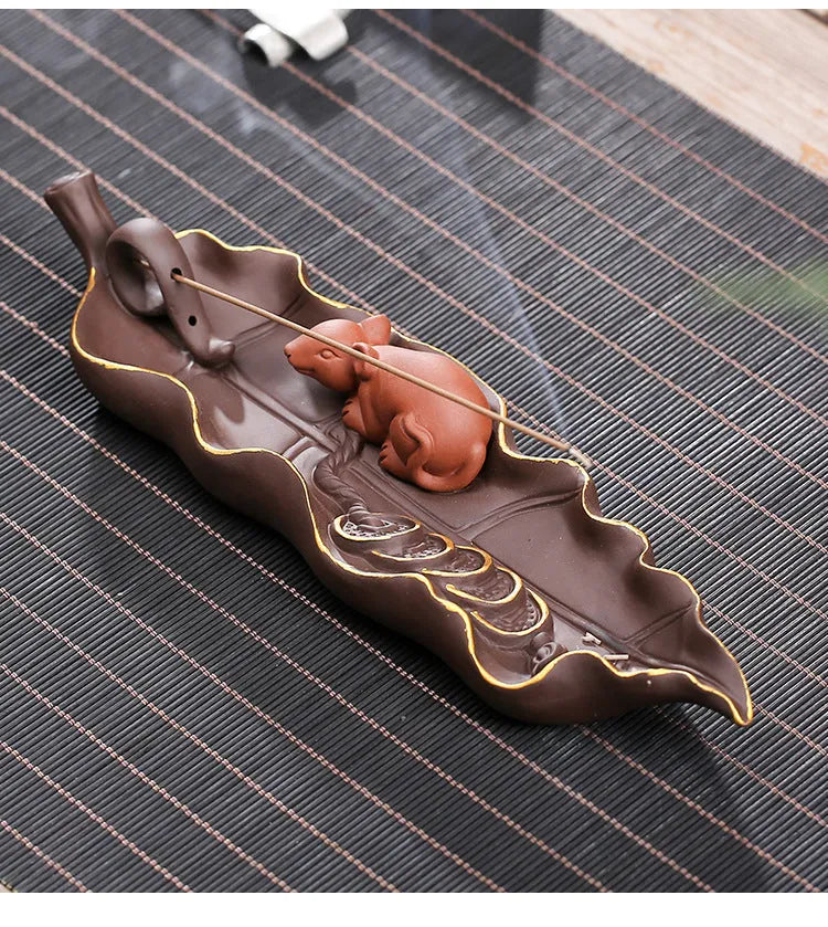 Purple clay ceramic lying incense holder with golden rat decoration