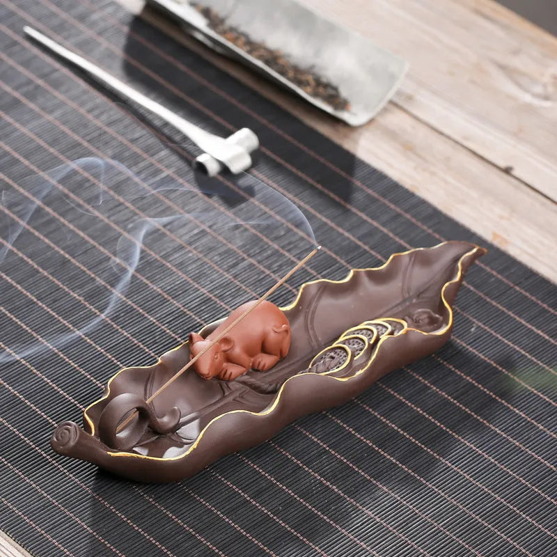 Purple clay ceramic lying incense holder with golden rat decoration