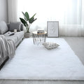 Nordic style fluffy rectangle carpet in light yellow colour showing plush texture and plain pattern
