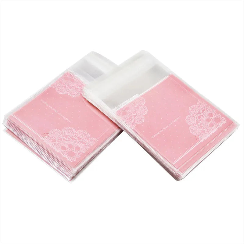 Pink self-adhesive plastic packaging bag showing adhesive strip and 7x7cm dimensions.