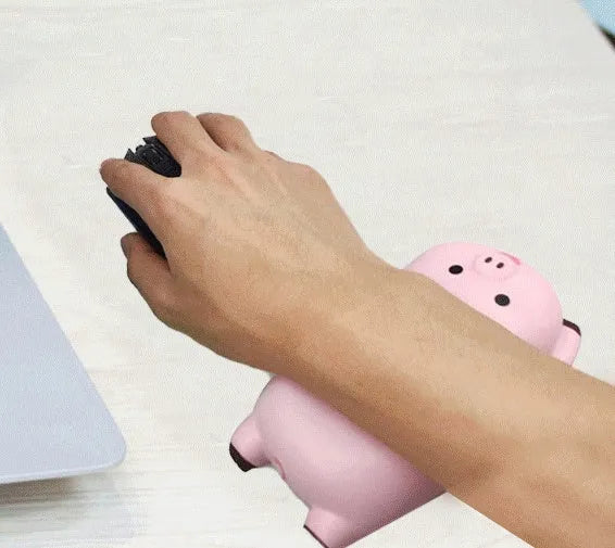 Black injection moulded PU wrist rest mouse pad on a desk, showing 130mm x 70mm size and raised pillow shape.