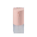 Blue columnar USB desktop humidifier with water tank and aromatherapy function on a wooden table.