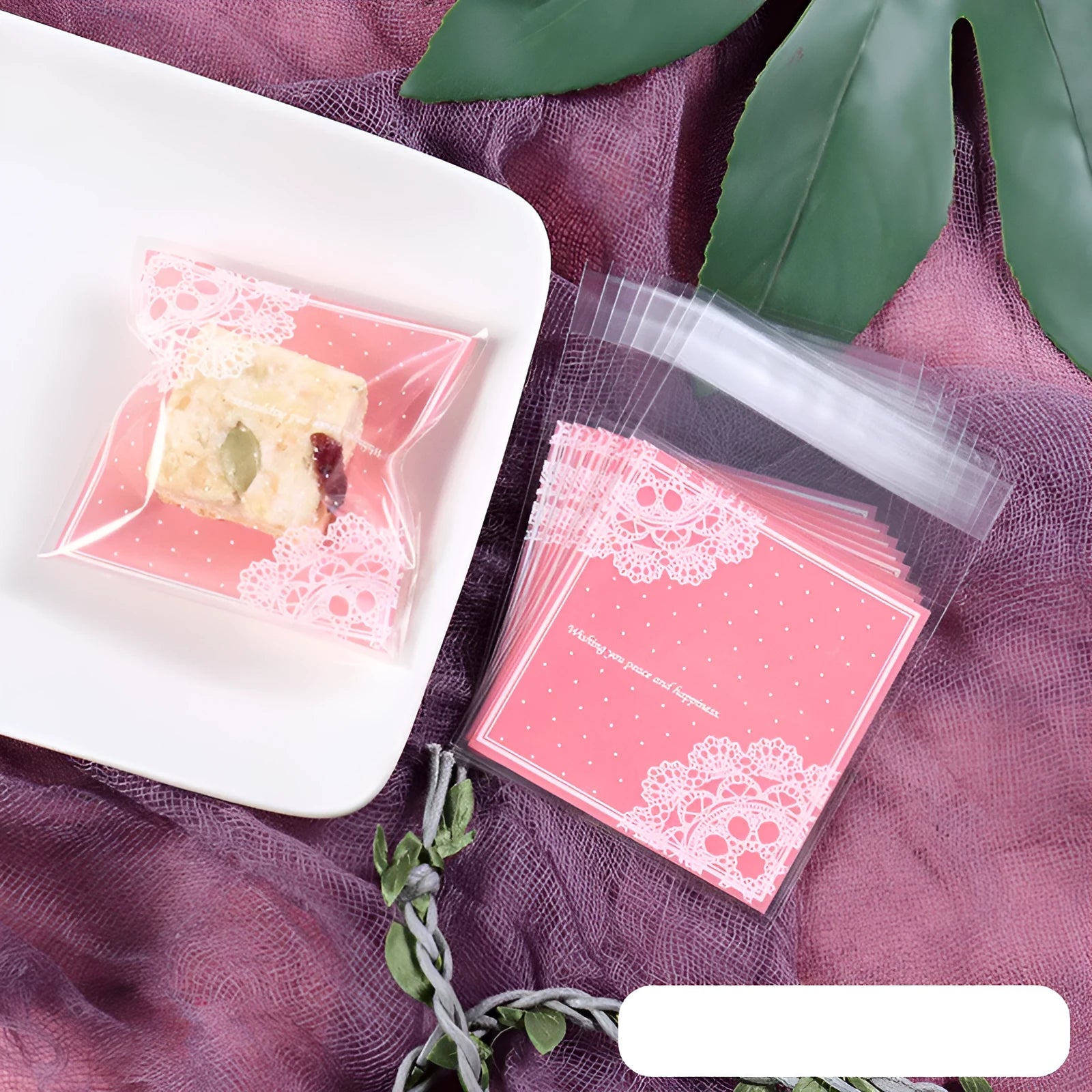 Pink self-adhesive plastic packaging bag showing adhesive strip and 7x7cm dimensions.