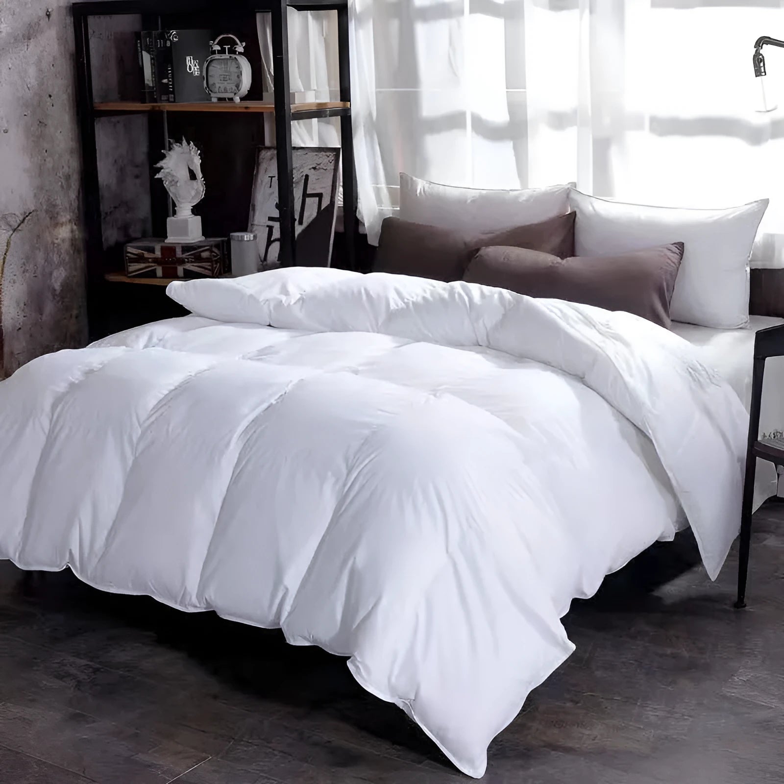 Goose down winter duvet in twill fabric, shown in beige colour on a bed.
