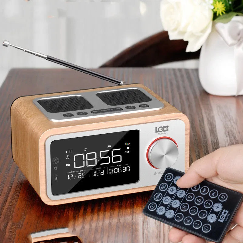 Compact wooden Bluetooth speaker with digital alarm clock display and FM radio functions in golden oil colour finish