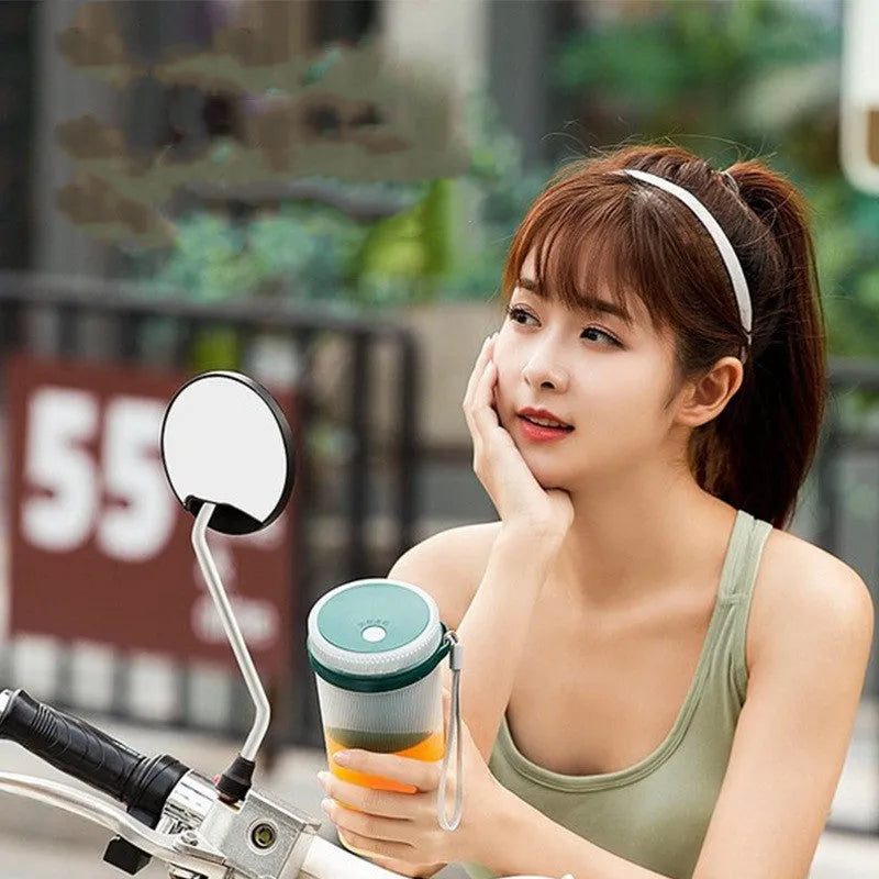 Portable pink electric juicer cup with USB charger and round feeding port
