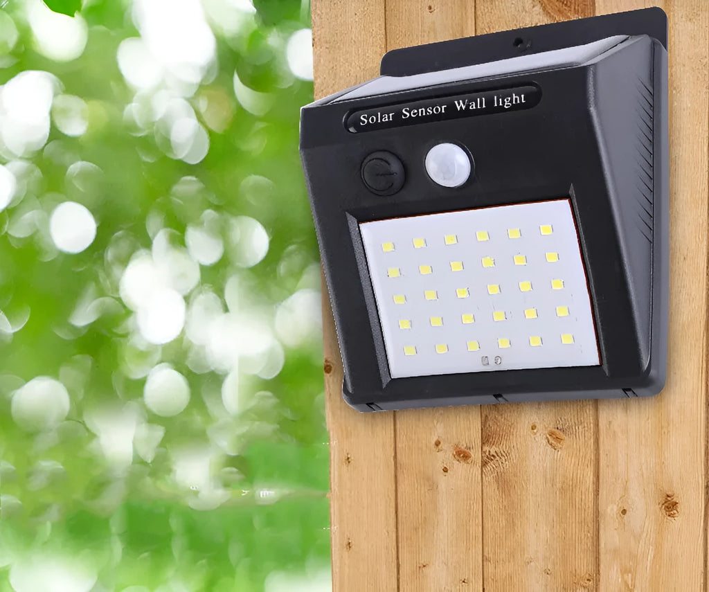 Solar powered outdoor garden lamp with motion sensor and 30 LED lights for automatic pathway illumination