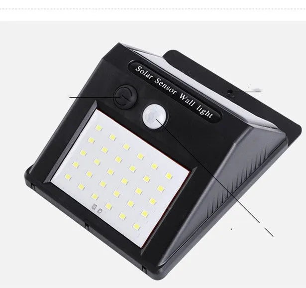 Solar powered outdoor garden lamp with motion sensor and 30 LED lights for automatic pathway illumination
