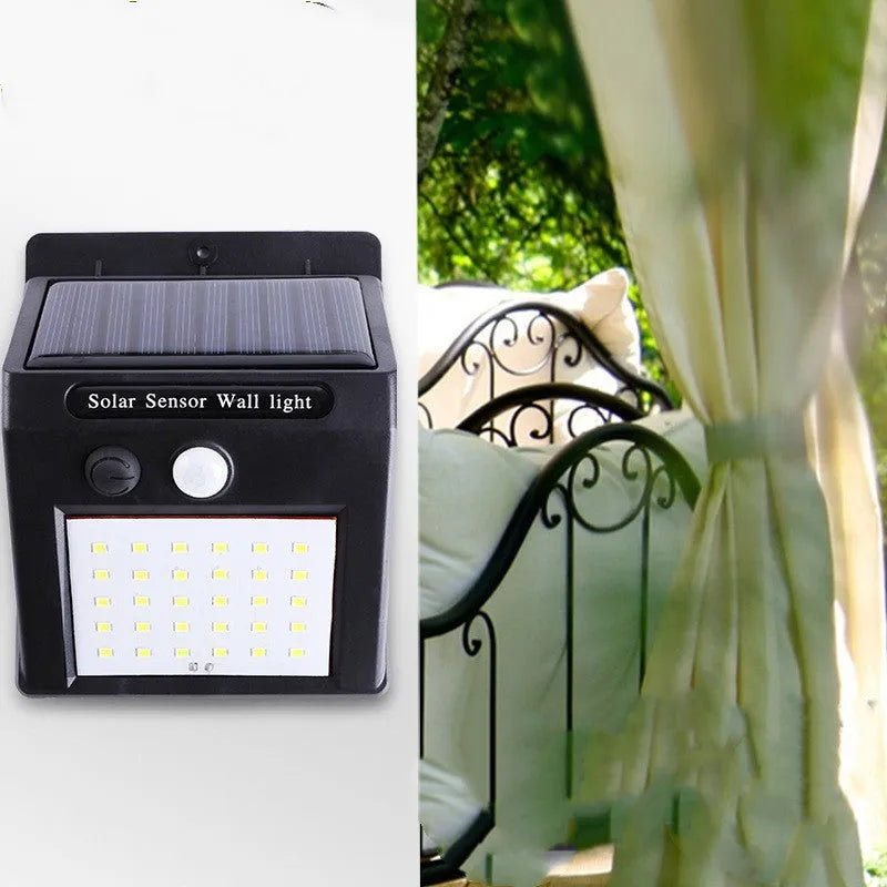 Solar powered outdoor garden lamp with motion sensor and 30 LED lights for automatic pathway illumination