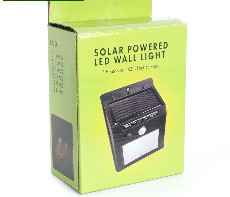 Solar powered outdoor garden lamp with motion sensor and 30 LED lights for automatic pathway illumination