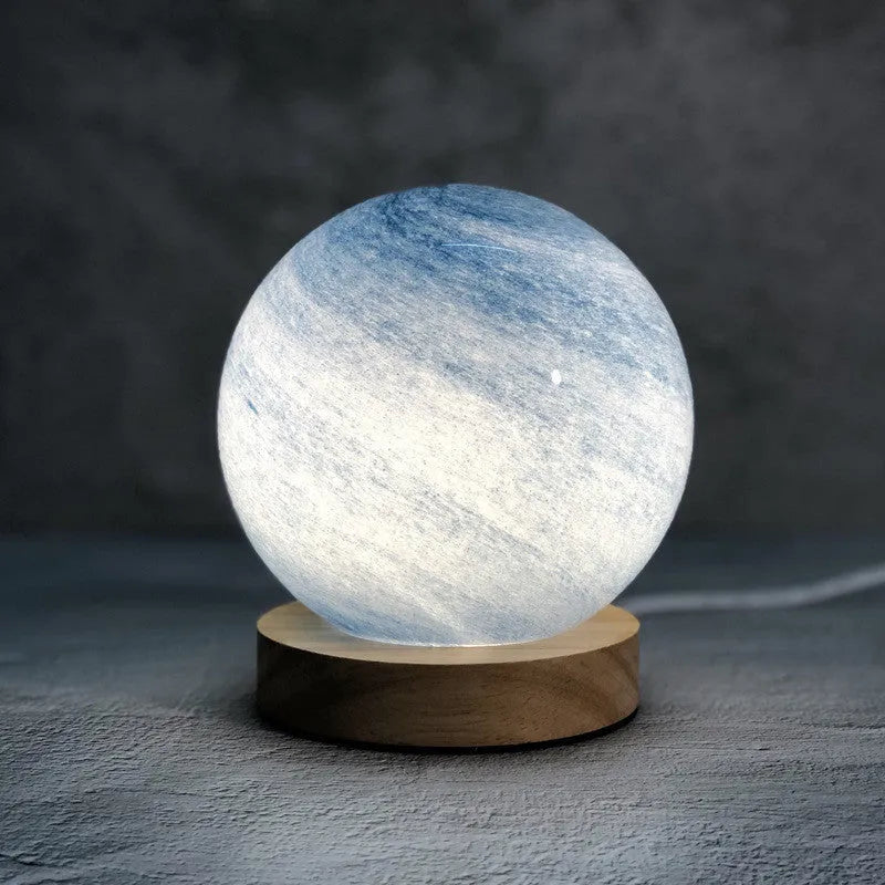 Nordic style bedside table lamp with glass lampshade on wooden table