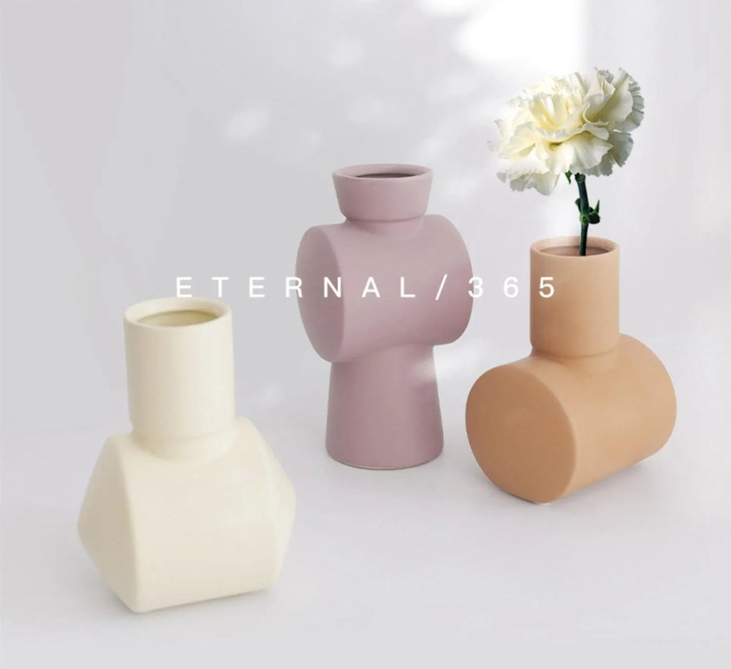 Nordic Morandi style hammer ceramic vase in beige, brown, or purple on a shelf.