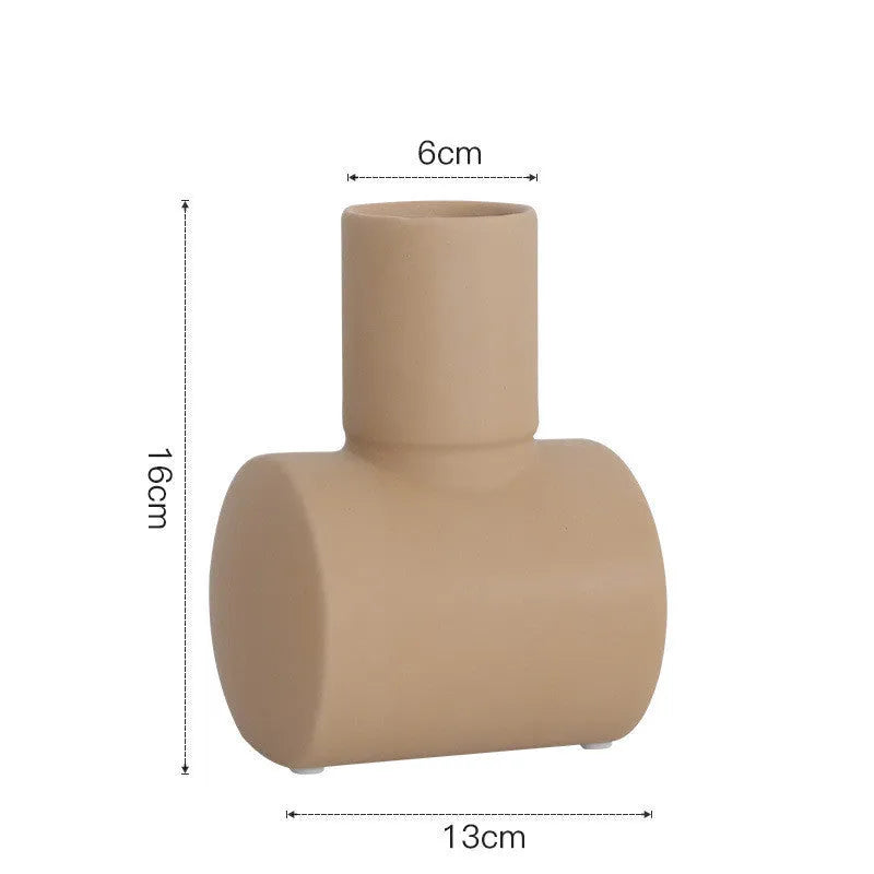 Nordic Morandi style hammer ceramic vase in beige, brown, or purple on a shelf.