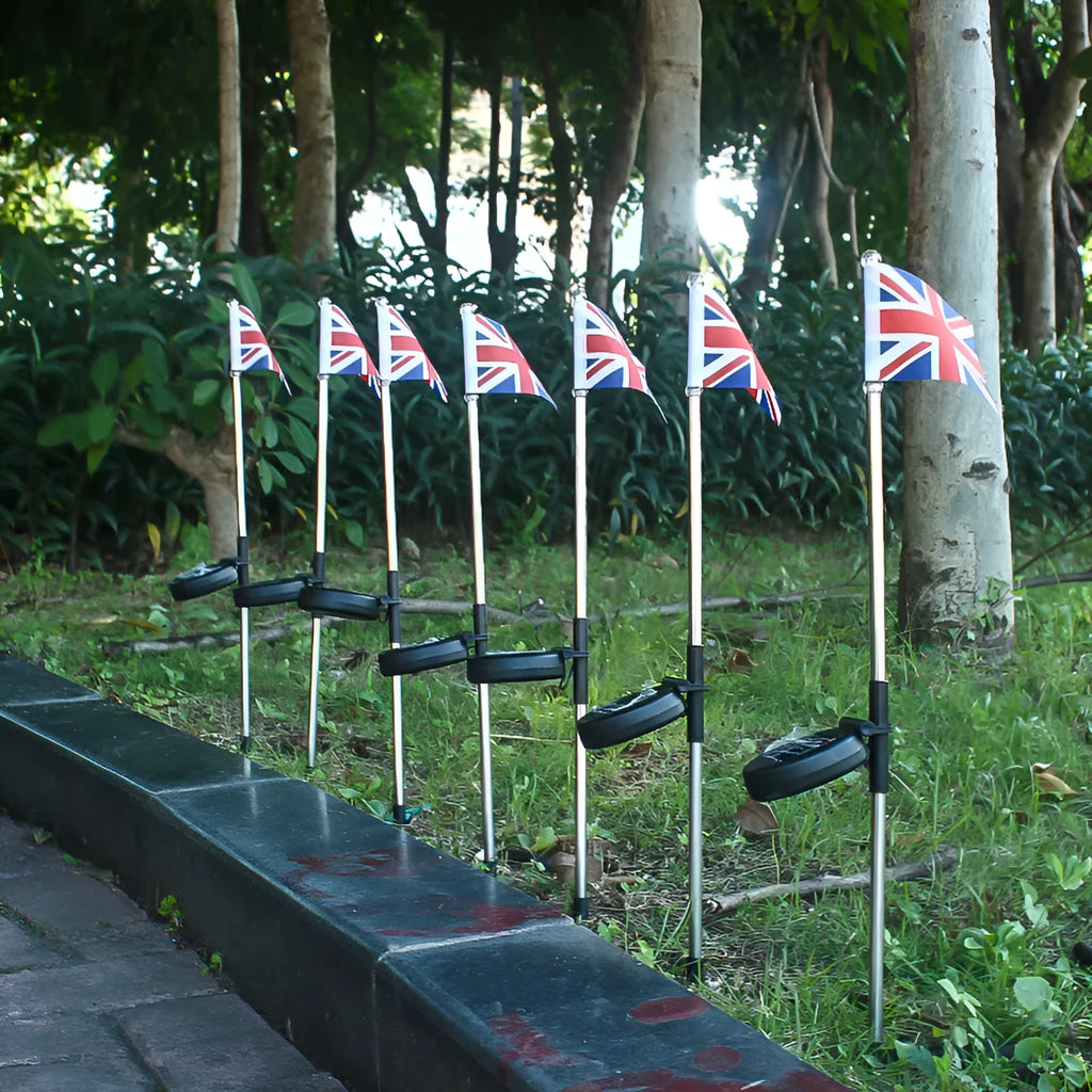 Solar garden flag light with stainless steel stake showing American flag design illuminated by white LEDs