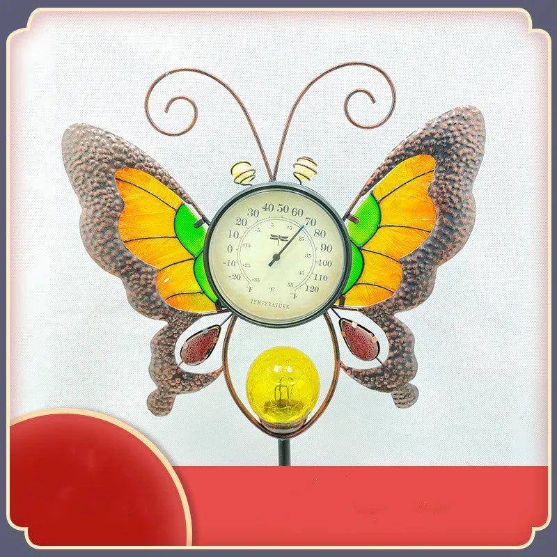 Solar garden thermometer butterfly stake measuring 30x6x110cm inserted in lawn