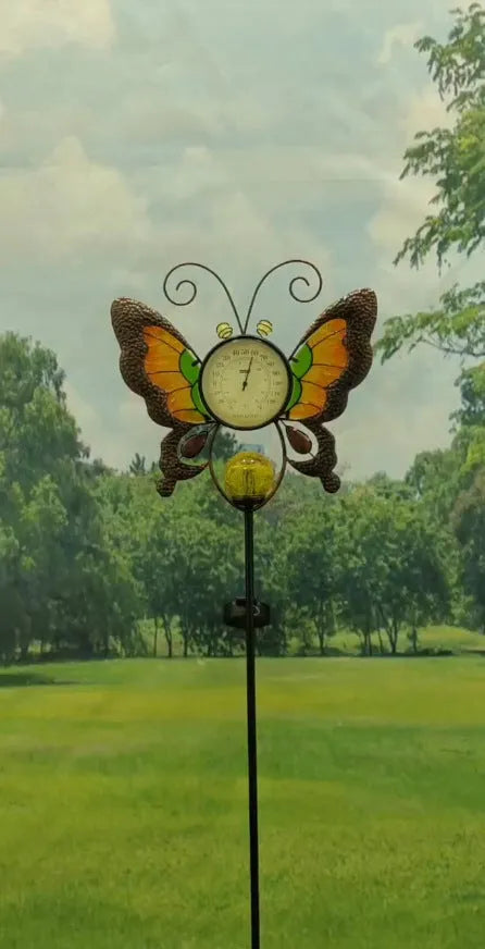 Solar garden thermometer butterfly stake measuring 30x6x110cm inserted in lawn