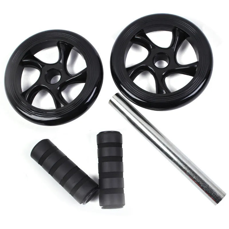 Silent abdominal wheel with kneeling pad, black colour, 165mm diameter, on a gym mat